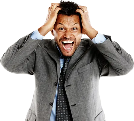 A stressed business man pulling his hair